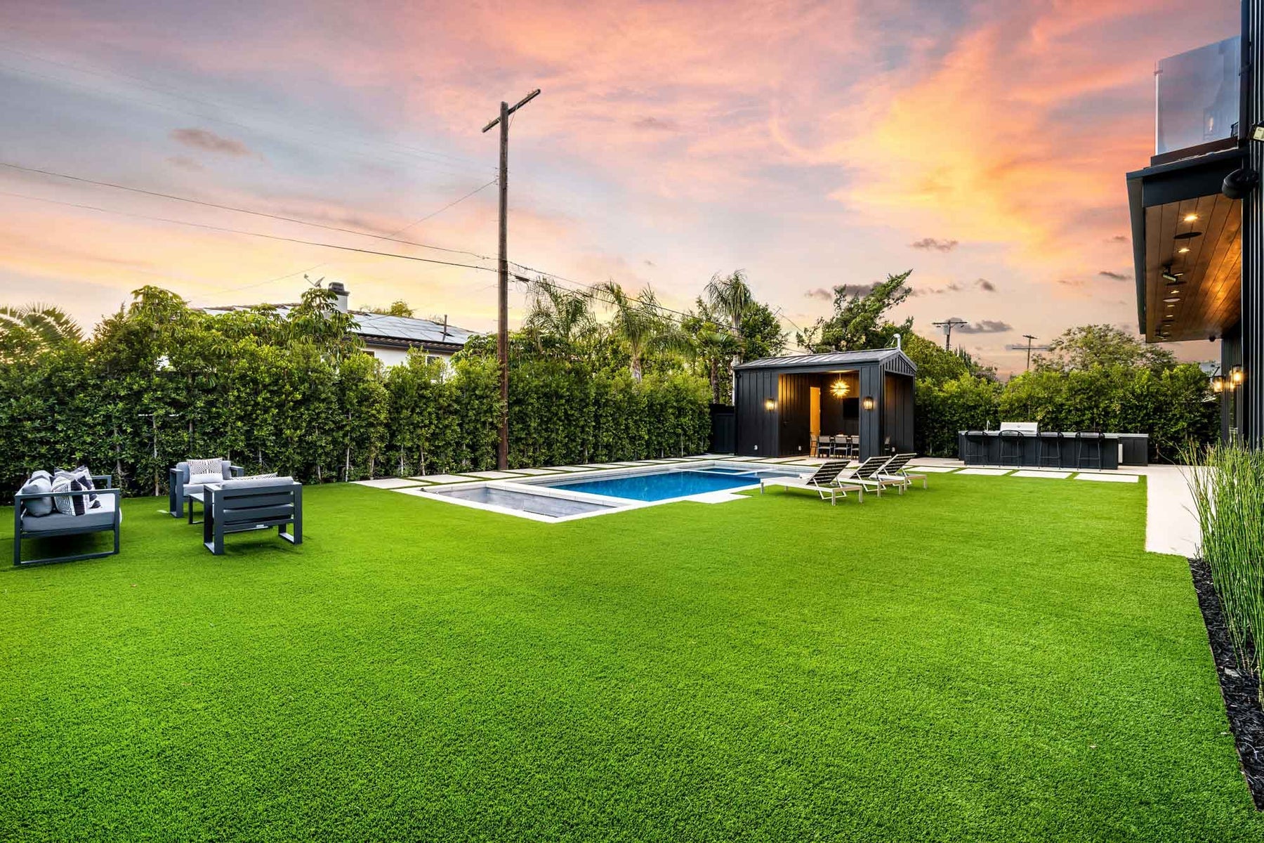 Rymar artificial turf backyard lawn and pool surround - manufacturer photo