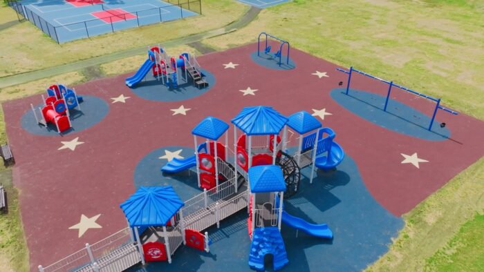 Accessible playground with poured-in-place surfacing at Erie Street Park, Village of Goshen