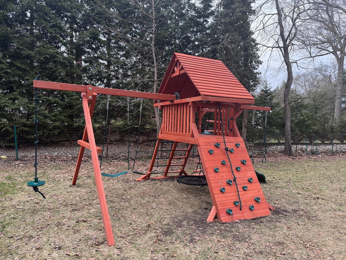 Playground One Original Playcenter with a wood roof in Ho-Ho-Kus, NJ