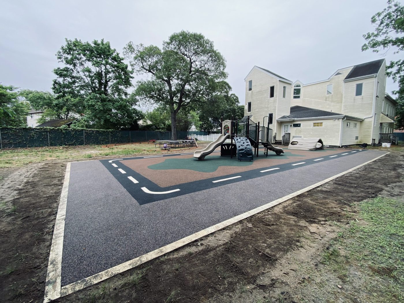 Son Catchers Daycare playground in Somers Point, NJ, poured-in-place rubber surfacing with a road-play design