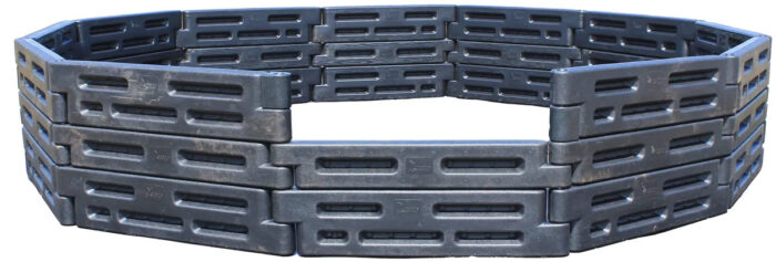 2by2 Industries in-ground high-wall gaga ball pit, three rows of black plastic border timbers with an entry cutout