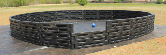 26 foot high-wall gaga ball pit, three rows of plastic border timbers around a wide playing area