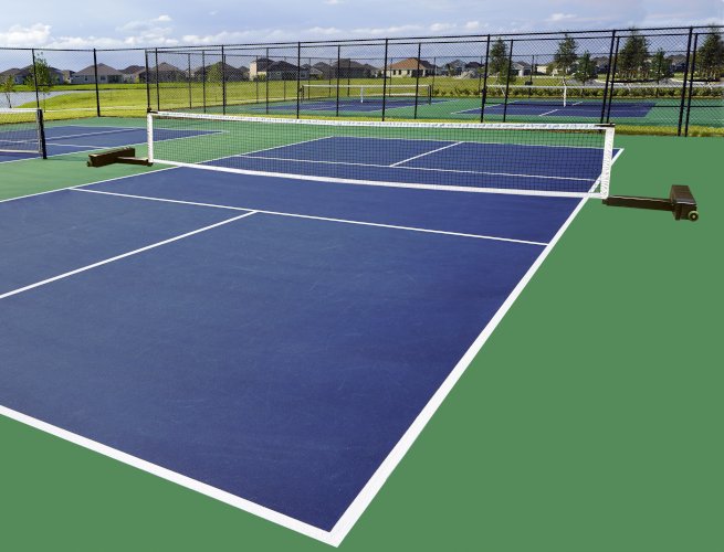 Portable pickleball net on weighted bases across a blue outdoor pickleball court